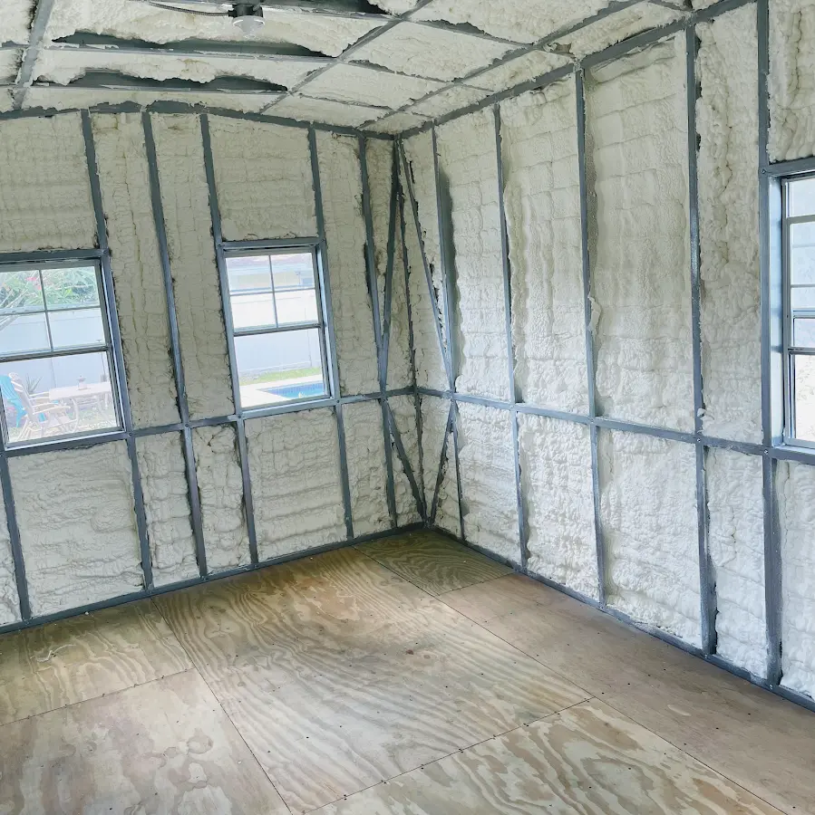 Closed-cell spray foam insulation applied to wall cavities in a residential project in Goshen
